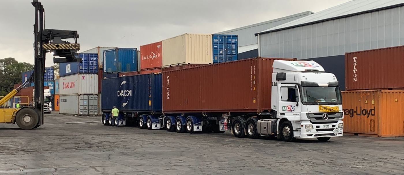 BCQ prime mover loaded with shipping containers
