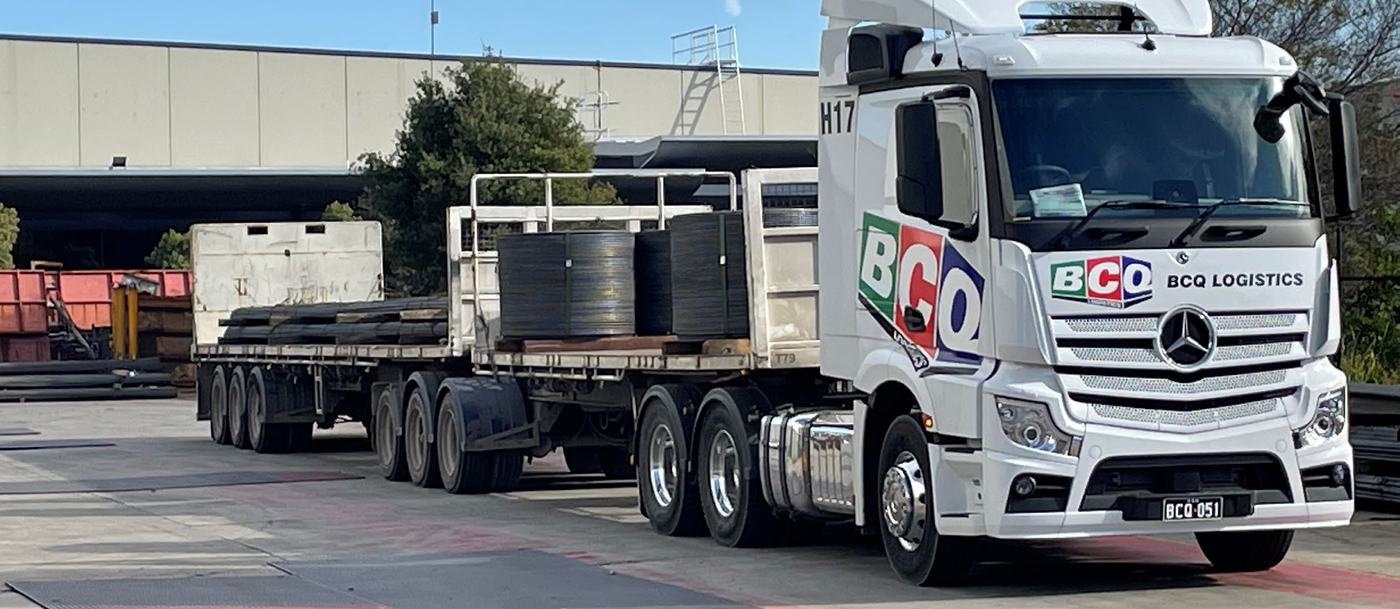 BCQ trucks and forklift in the warehouse and yard